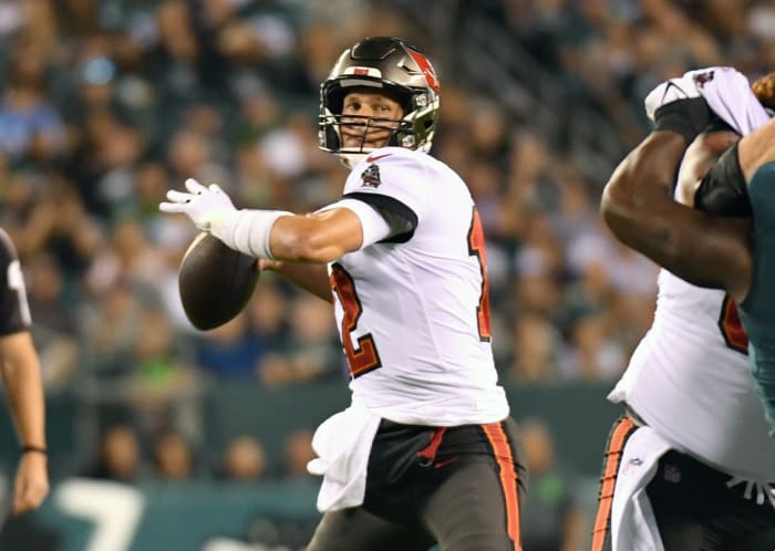 Oct 14, 2021; Philadelphia, Pennsylvania, USA; Tampa Bay Buccaneers quarterback Tom Brady (12) looks for a receiver against the Philadelphia Eagles during the first quarter at Lincoln Financial Field. Mandatory Credit: Eric Hartline-USA TODAY Sports
